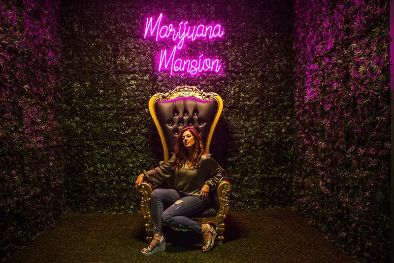 Image: Lisa Leder makes herself at home at the Marijuana Mansion.