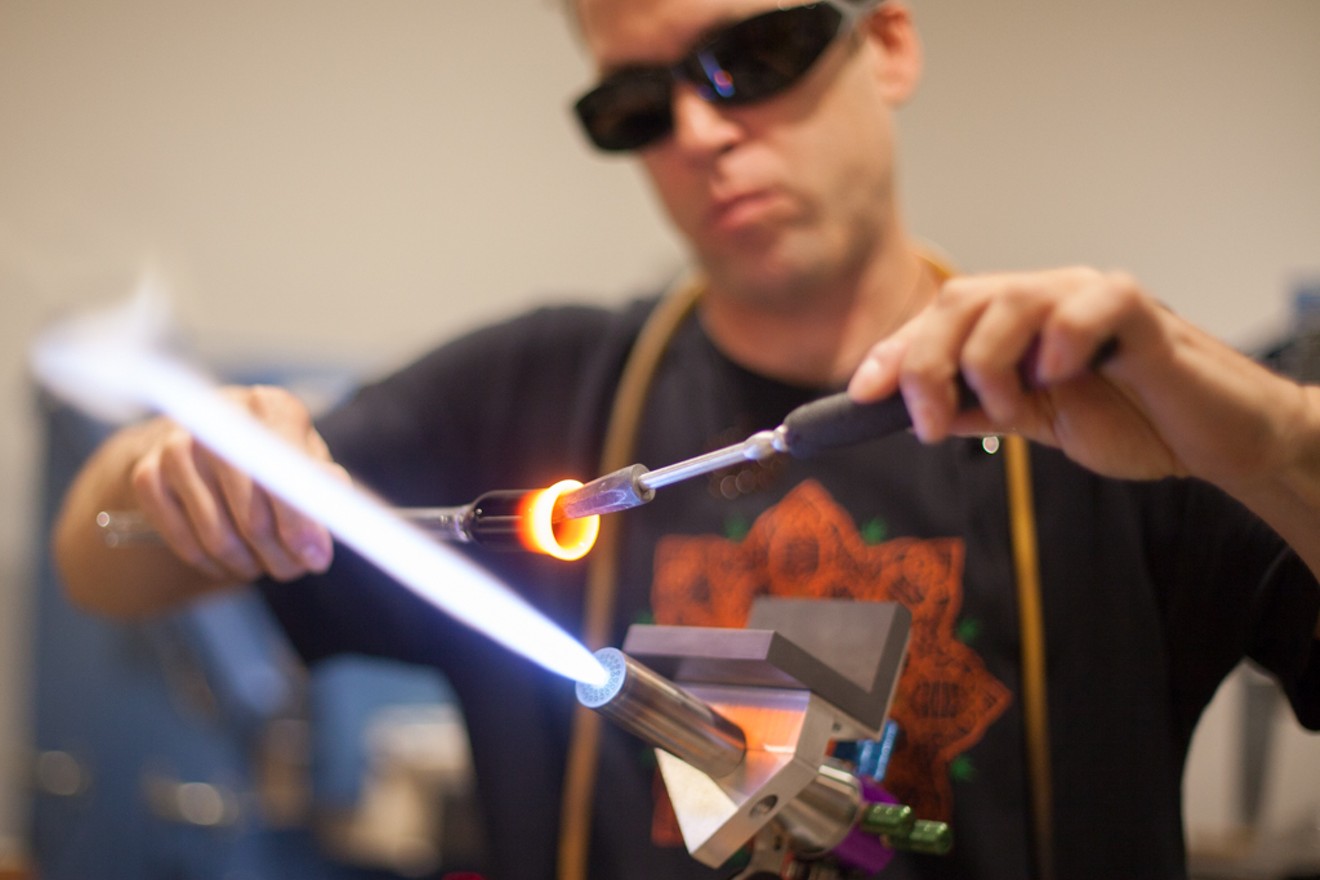 Glassblower Eric Pitts works in a live studio at Colorado Harvest Company.