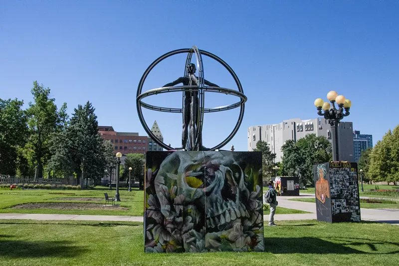 Image: The statue dedicated to Columbus now has a Denver Black Love Mural Festival wrap.
