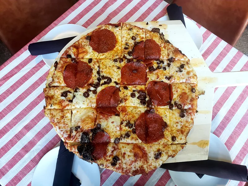 Image: A simple pepperoni and olive tavern-style pizza at Grabowski's.