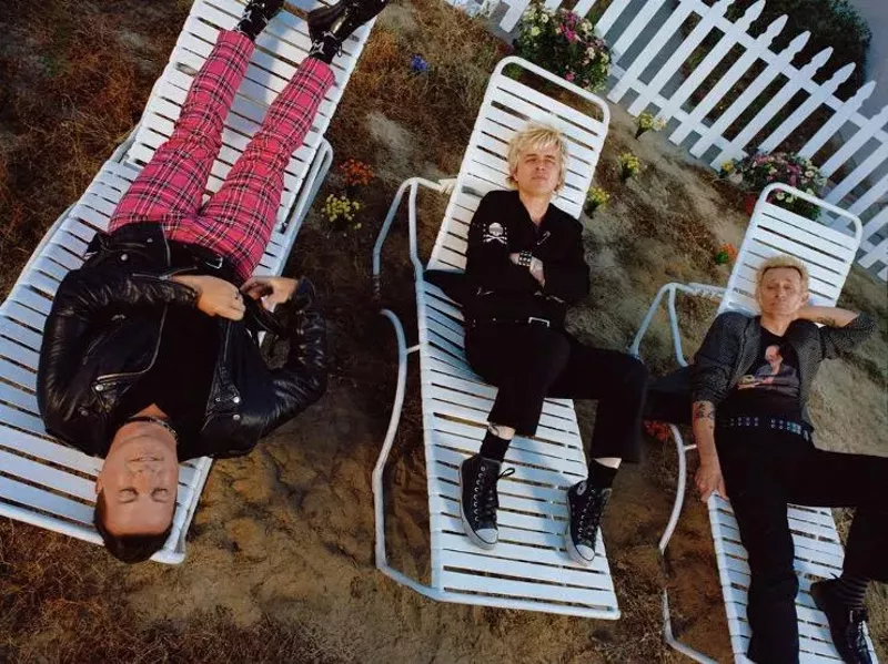 Image: men sitting on lawn chairs