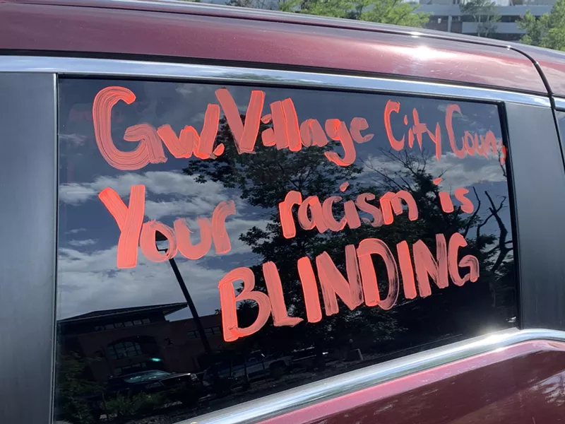 Image: The message on this car at a July 9 protest in Greenwood Village didn't mince words.