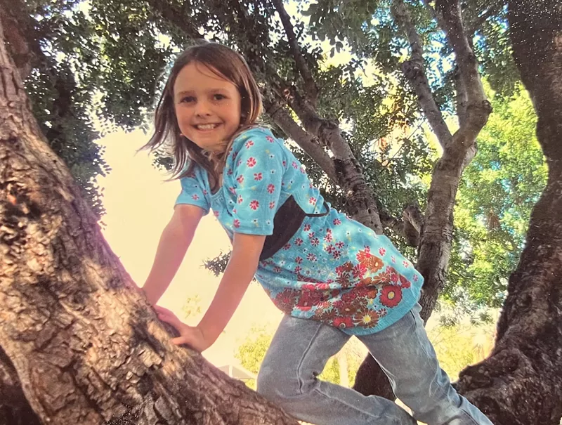 Image: girl climbing tree