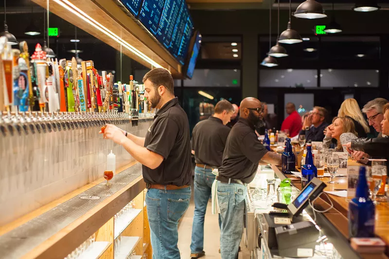 Image: All those tap handles, and the kegs they're attached to, are owned by the separate breweries represented at places like Growler USA.