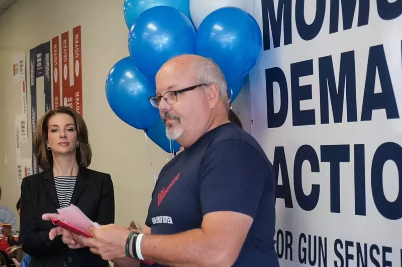 Image: Tom Sullivan, who lost his son in the Aurora theater shooting, speaking at a Moms Demand Action phone bank event.