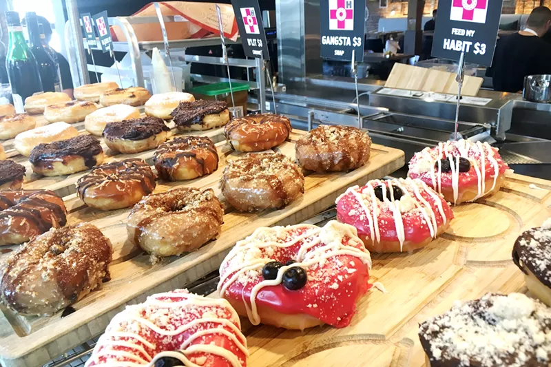 Image: Monthly specials and Habit classics fill the doughnut shelves.