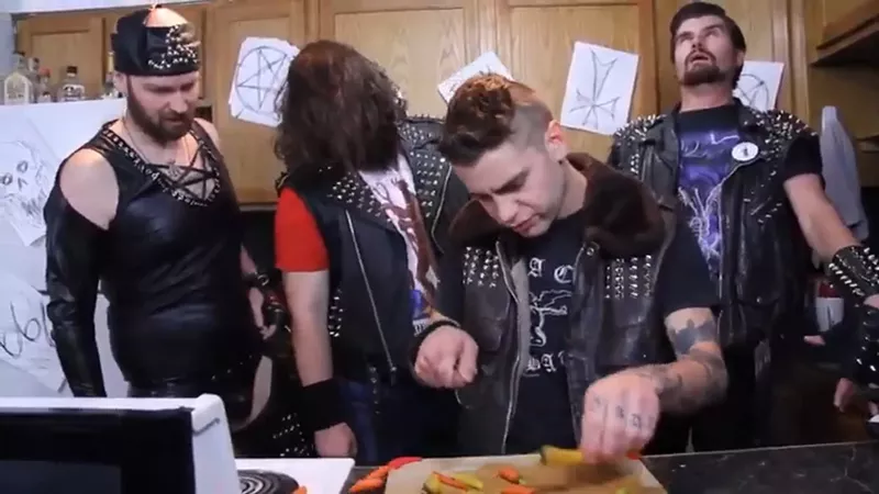 Image: After snatching up a white supremacist from a porta-potty, the members of Hail Satan chop, cook and eat his ribs in the first installment of I Will Eat You With Hail Satan,.
