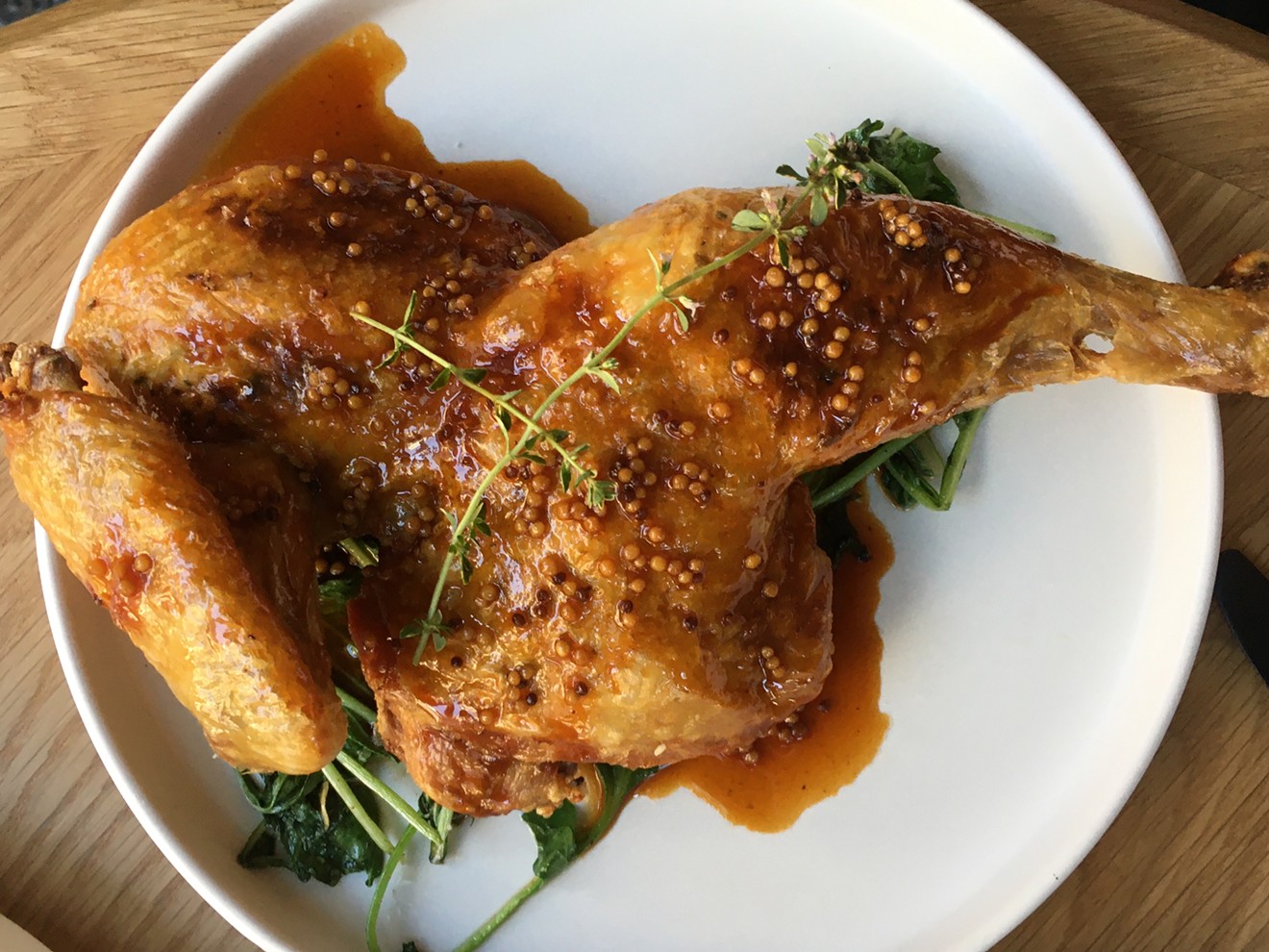 A roasted half chicken with Rebel Farm greens is a good representation of the menu at Local Jones.
