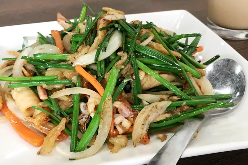 Image: The Happy Cafe Special has garlic chives, squid and dried shrimp in a mild sauce.