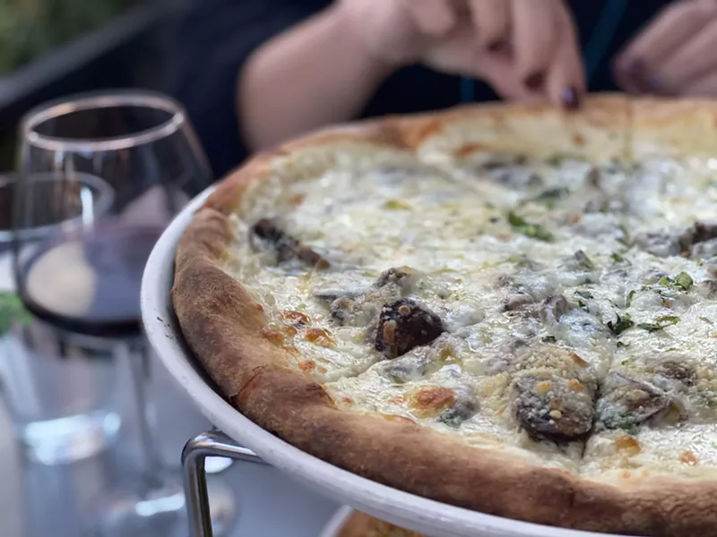 Image: Osteria Marco's classic wild-mushroom pizza with Tallegio and truffle oil.