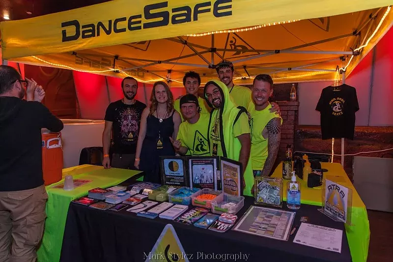 Image: a booth for DanceSafe at a concert