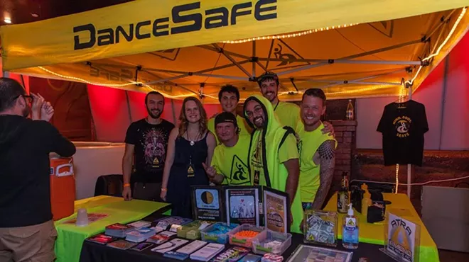 a booth for DanceSafe at a concert