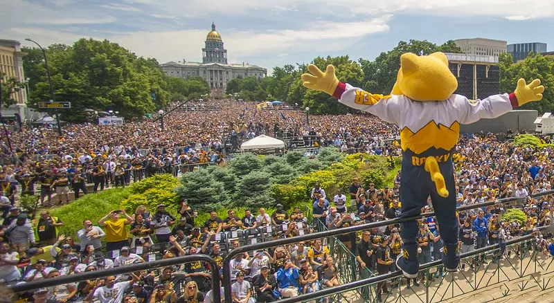 Image: big crowd with basketball mascot in front