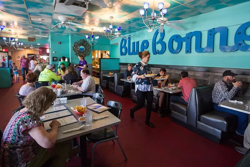 Image: people at booths in a restaurant