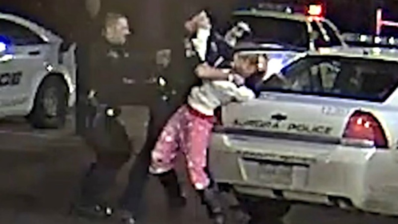 An Aurora police officer bends OyZhana Williams over a squad car by Aurora Police Department Sergeant Michael Hawkins, as seen in a video on view below.