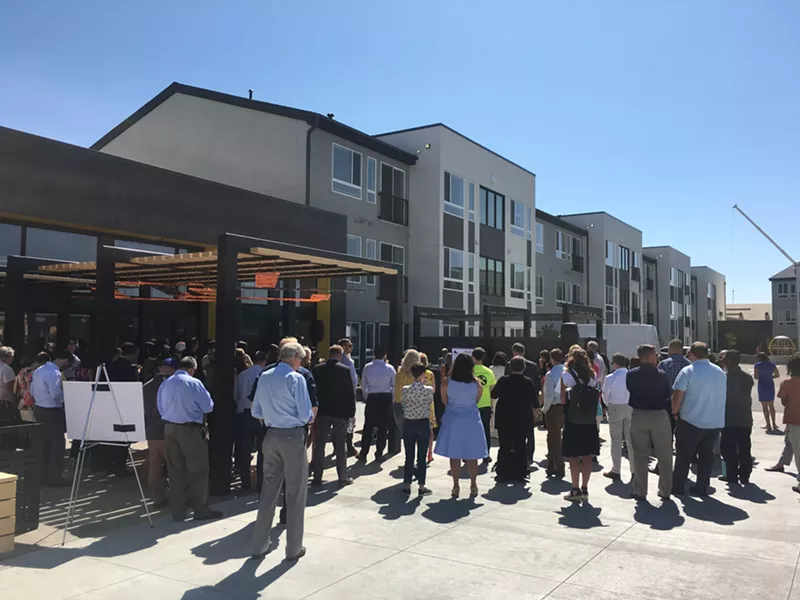 Image: Crowds gathering to see the brand-new Moline Apartments, an affordable-housing complex in Stapleton funded in part by marijuana tax revenue.