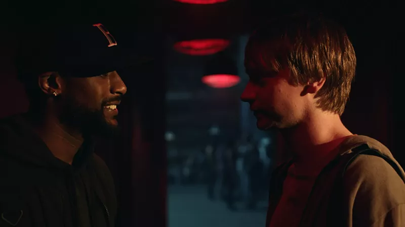 Image: Calum Worthy (right) plays grad student Adam Merkin, who gets hooked on battle-rap competitions after consulting with a master named Behn Grymm (Jackie Long), in director Joseph Kahn's Bodied.