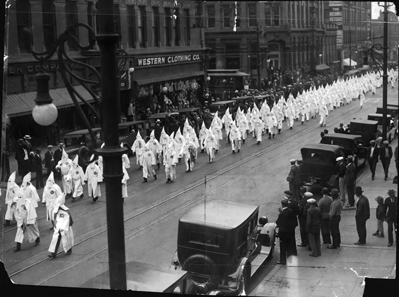 Image: In May 1926, Klan members marched down the streets of Denver for a parade that preceded a KKK convention.