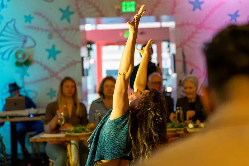 Image: A performer in a restaurant.