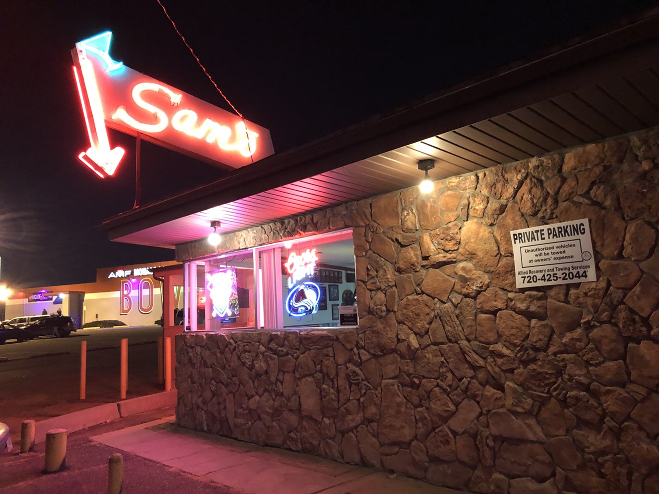 The neon sign at Sam's Bar & Lounge has welcomed neighbors since the 1950s.