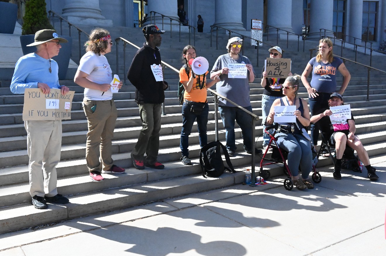 About a dozen members and supporters of the Housekeys Action Network Denver rallied outside the Denver City and County Building on April 15, demanding more long-term housing vouchers from Mayor Mike Johnston.