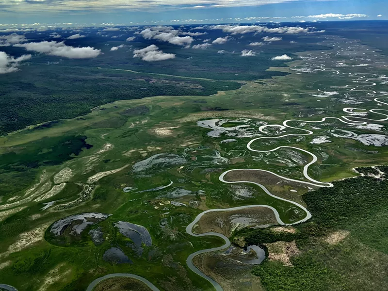 Image: The Okavango River system, starting at the Source Lakes in the highlands of Eastern Angola, spirals south toward the Namibian border, where it crosses the Caprivi Strip briefly and empties into the Okavango Delta in Botswana.