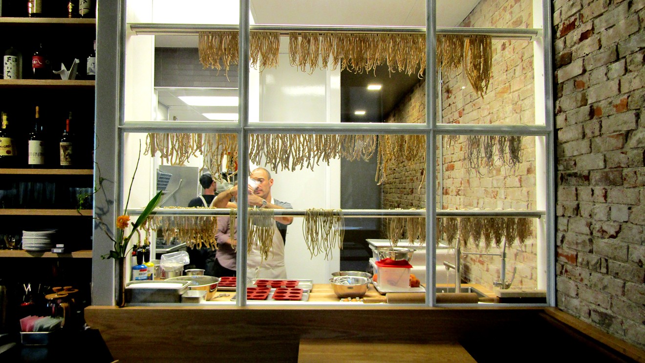 Housemade pasta hangs in the kitchen at The Wolf's Tailor.