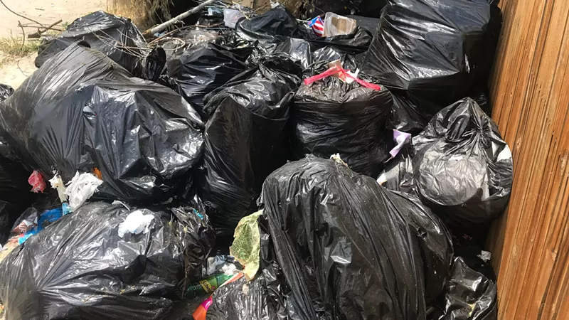 Image: The trash pile lingered for weeks.