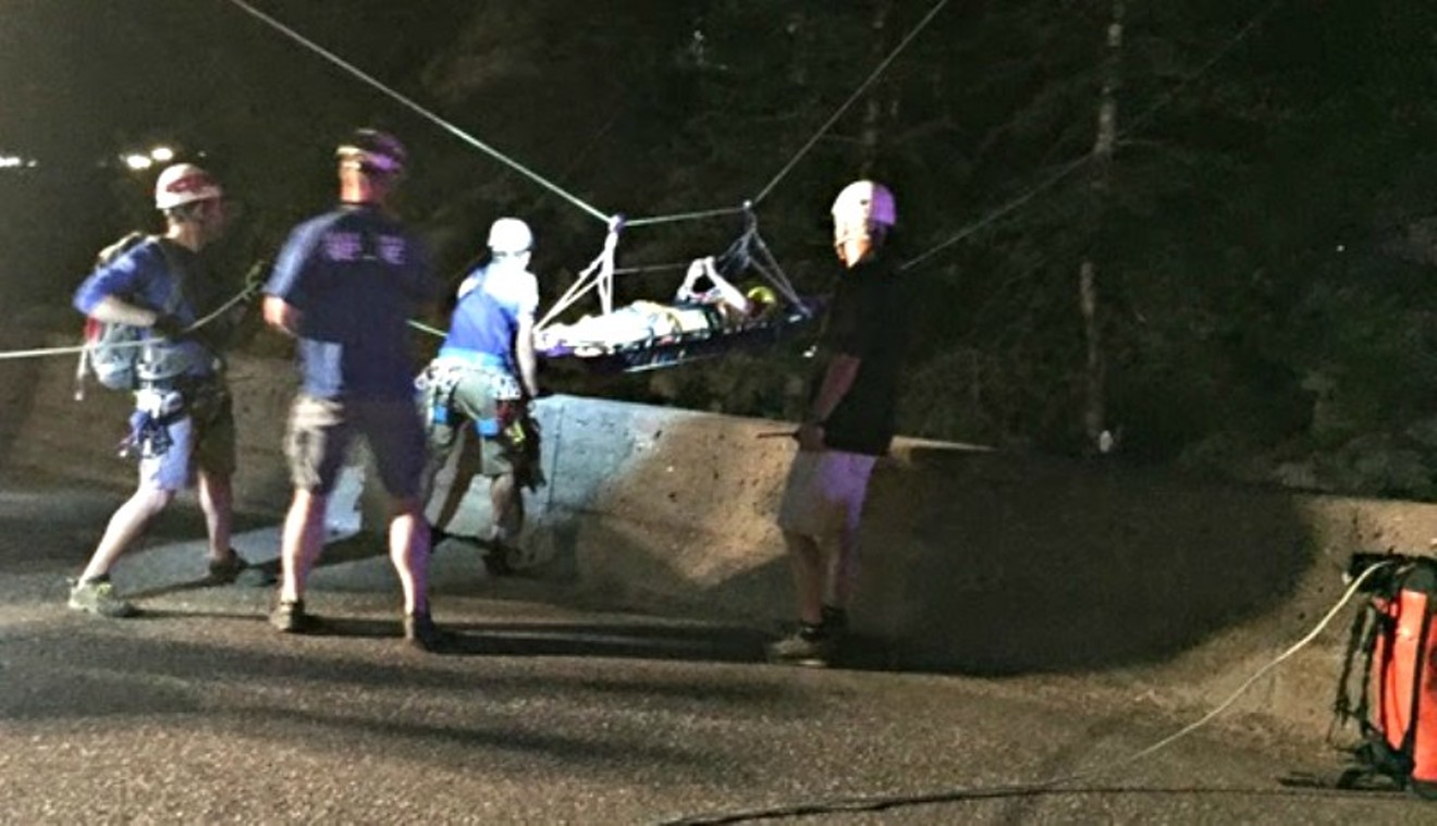 Rescue personnel transporting injured climber Molly Berkenhoff late last night. Additional photos below.