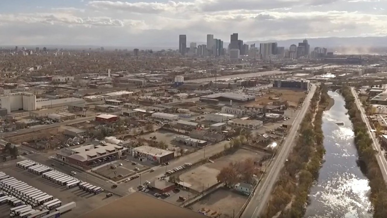 An overhead look at a portion of Globeville, with downtown Denver in the distance.
