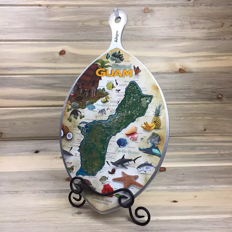 Image: One of Gerard Aflague's coconut graters, inlaid with an image of his home island of Guam.
