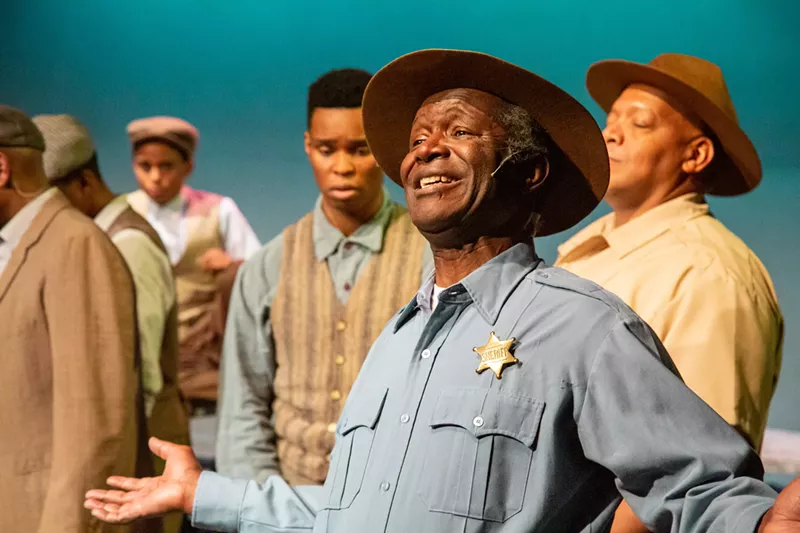 Image: Dwayne Carrington (center) and the cast of The Scottsboro Boys.
