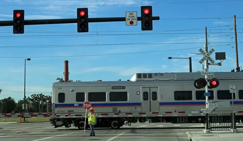 Image: The A Line continues to employ crossing guards because of a history of gate malfunctions.