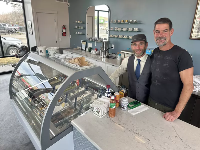 Image: two men behind an ice cream shop counter