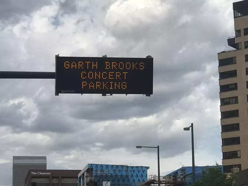 Image: Warnings about a looming Garth Brooks concert parking disaster started popping up around Denver on Wednesday.