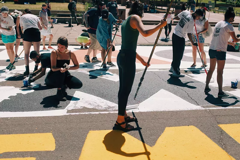 Image: Hundreds gather on Broadway to help with painting efforts of a new Black Lives Matter street mural on the morning of June 12.
