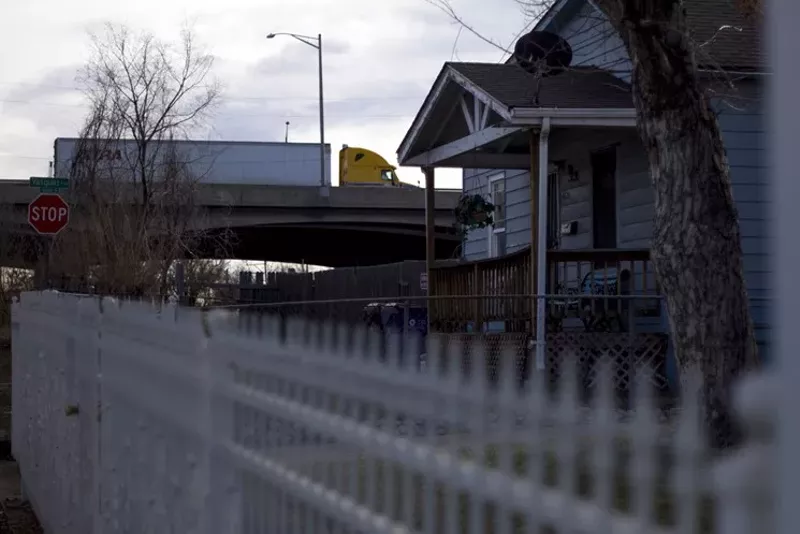 Image: A truck rumbles along the I-70 viaduct above a house in Elyria, crossing a stretch of the elevated highway that is scheduled for demolition.