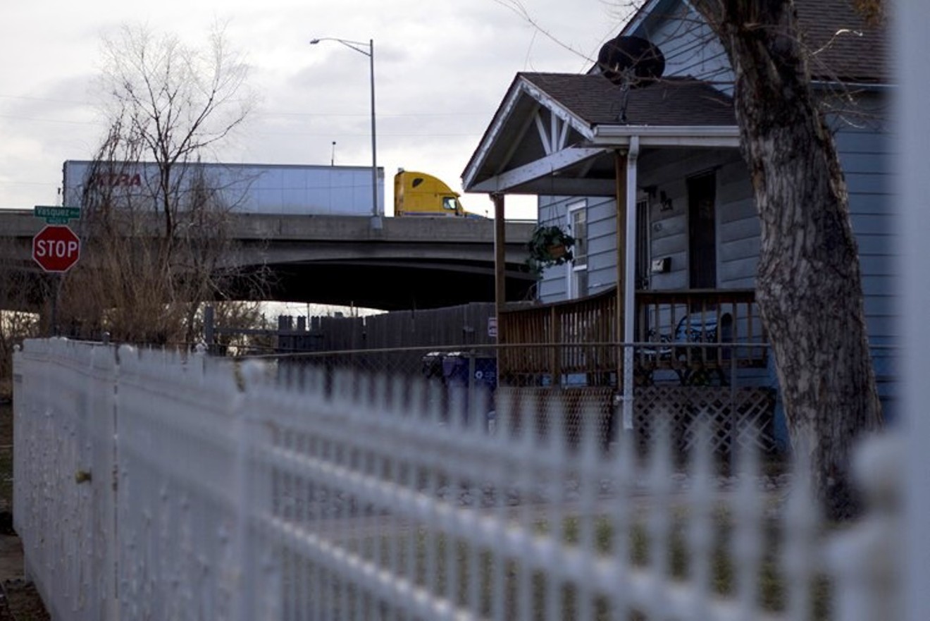 A truck rumbles along the I-70 viaduct above a house in Elyria, crossing a stretch of the elevated highway that is scheduled for demolition.