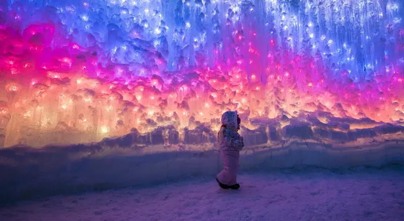 Image: Child exploring Ice Castles at night