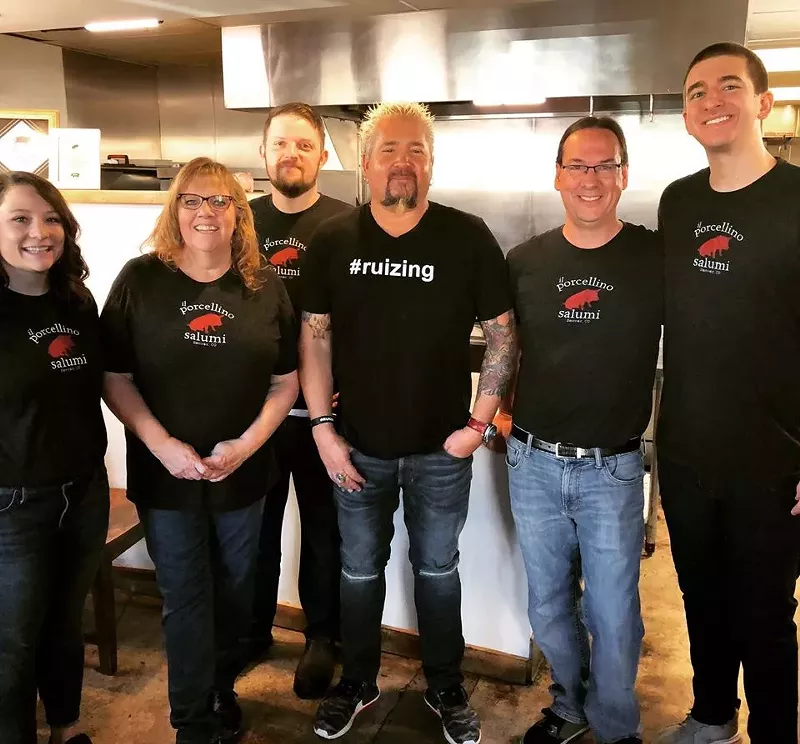 Image: Guy Fieri (center) of Food Network's Diners, Drive-Ins and Dives drops in on Bill Miner (second from right) and his team.