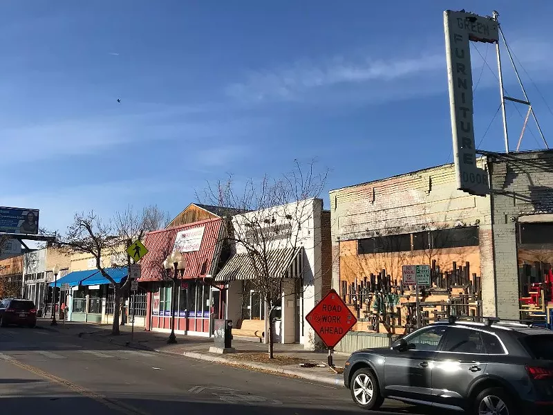 Image: Tennyson and 41st Streets, with what was Highlander Comics in the red building left of center.