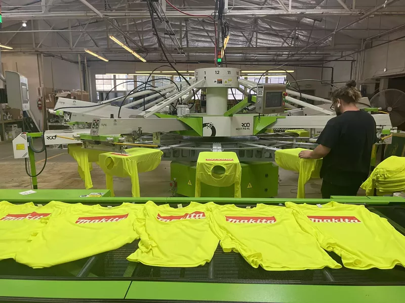 Image: A worker in a print production shop.
