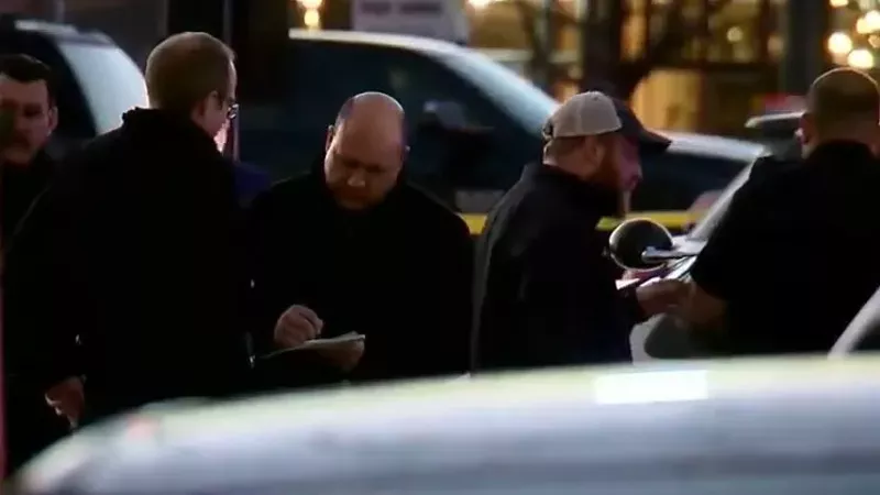 Image: Denver police investigators interviewing witnesses after the November 19 shooting.