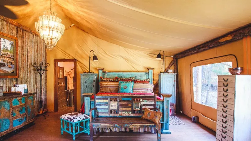 Image: Inside a tent at The Resort at Paws Up, a Montana facility that's among the models for the Colorado project.