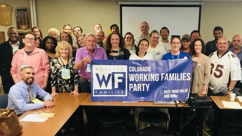 Image: Carlos Valverde, seated at far left, with staffers and supporters of the Colorado Working Families Party.