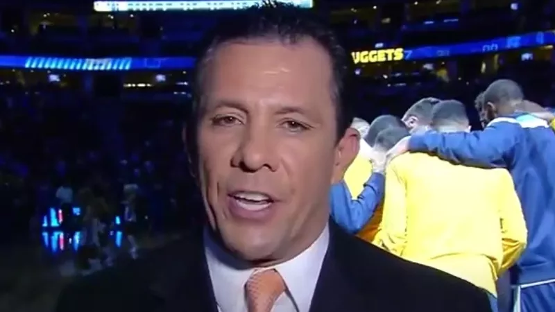 Image: Todd Romero, seen here at a Nuggets game several years ago, has filed suit against his employer, Altitude TV.