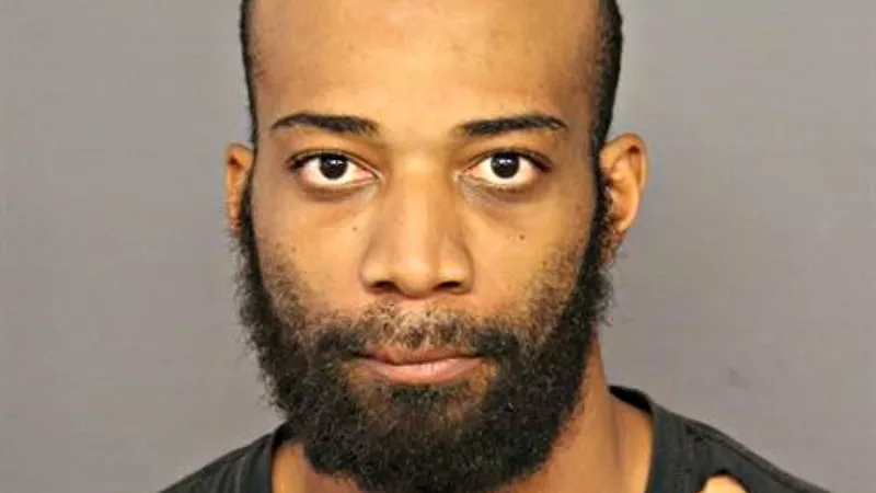 Image: A booking photo of David Henry.