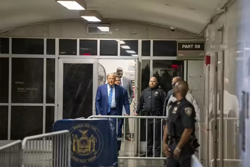 Image: Donald Trump walks out of court