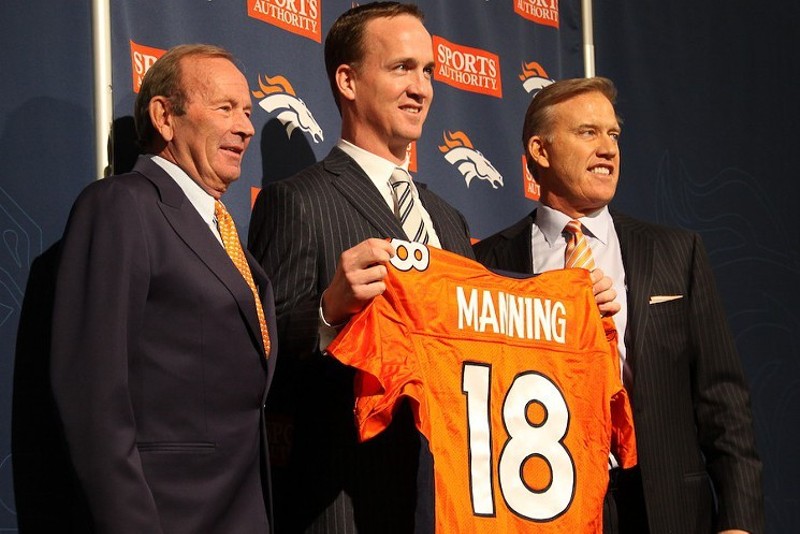 Peyton Manning with former Broncos owner Pat Bowlen and John Elway during Manning's inaugural press conference after joining the team.