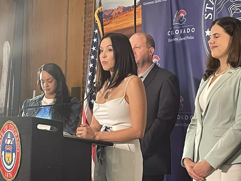 Image: Selene Nestor speaks at a press conference in Governor Jared Polis's office.